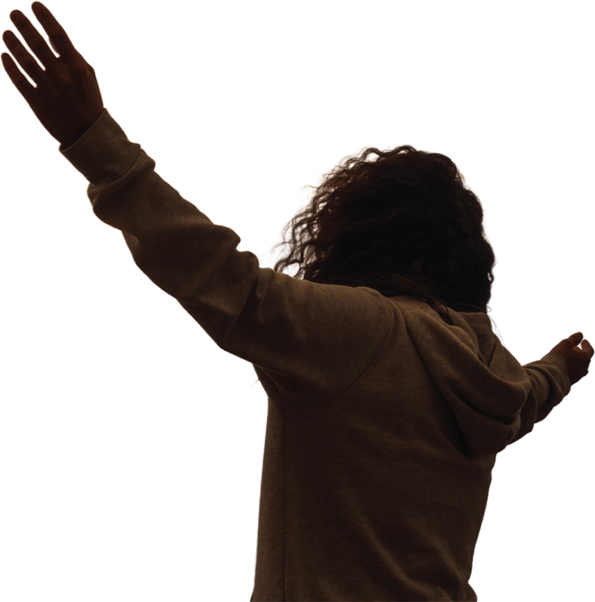 A person with arms raised in prayer